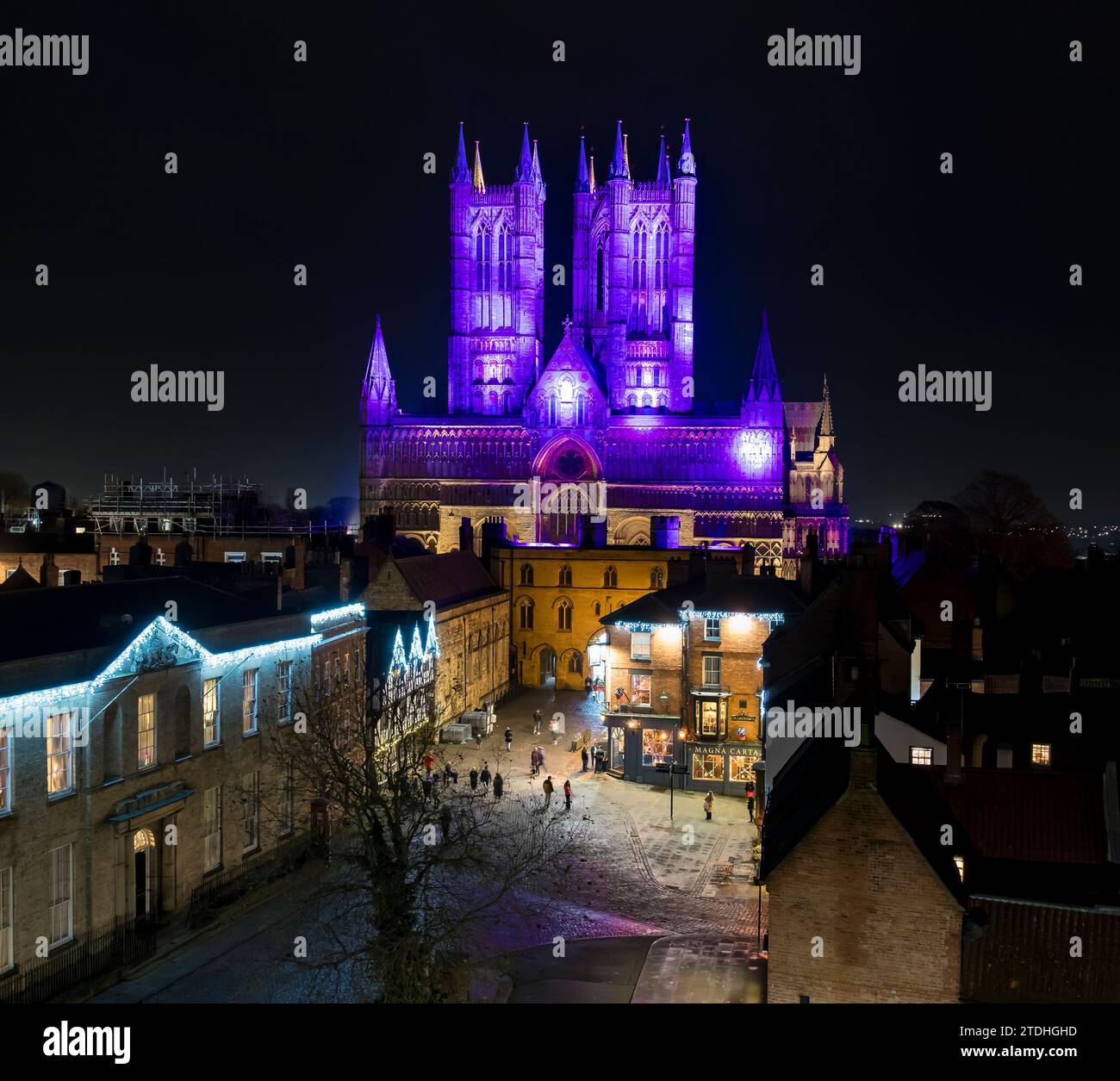 coloured illuminations on Lincoln cathedral from castle wall walk, Castle hill, exchequer gate