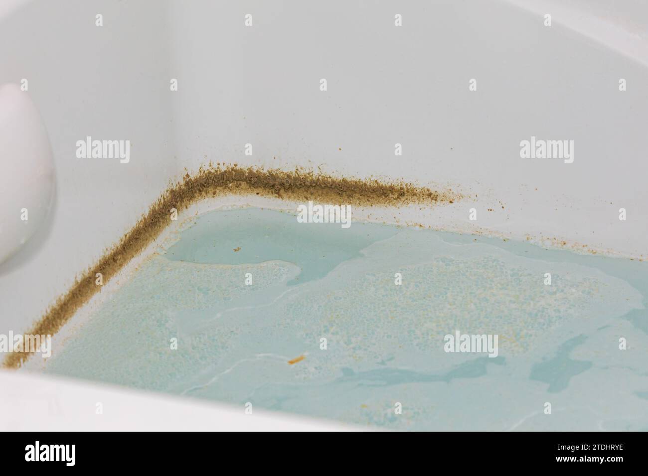 Whirlpool tub or jetted bathtub with dirty water. Household chores, bathroom cleaning and housekeeping concept. Stock Photo