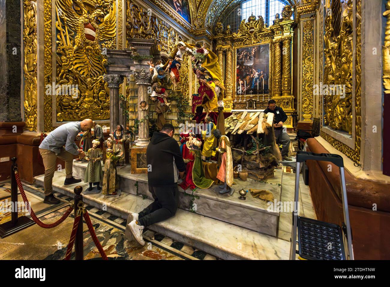 Setting up a nativity scene in St. John's Co-Cathedral in Valletta, Malta Stock Photo