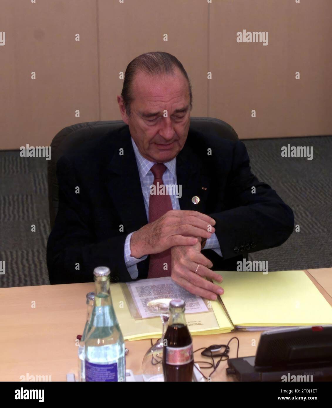 Barcelona, 03/15/2002. Jacques Choirac checks his watch during the