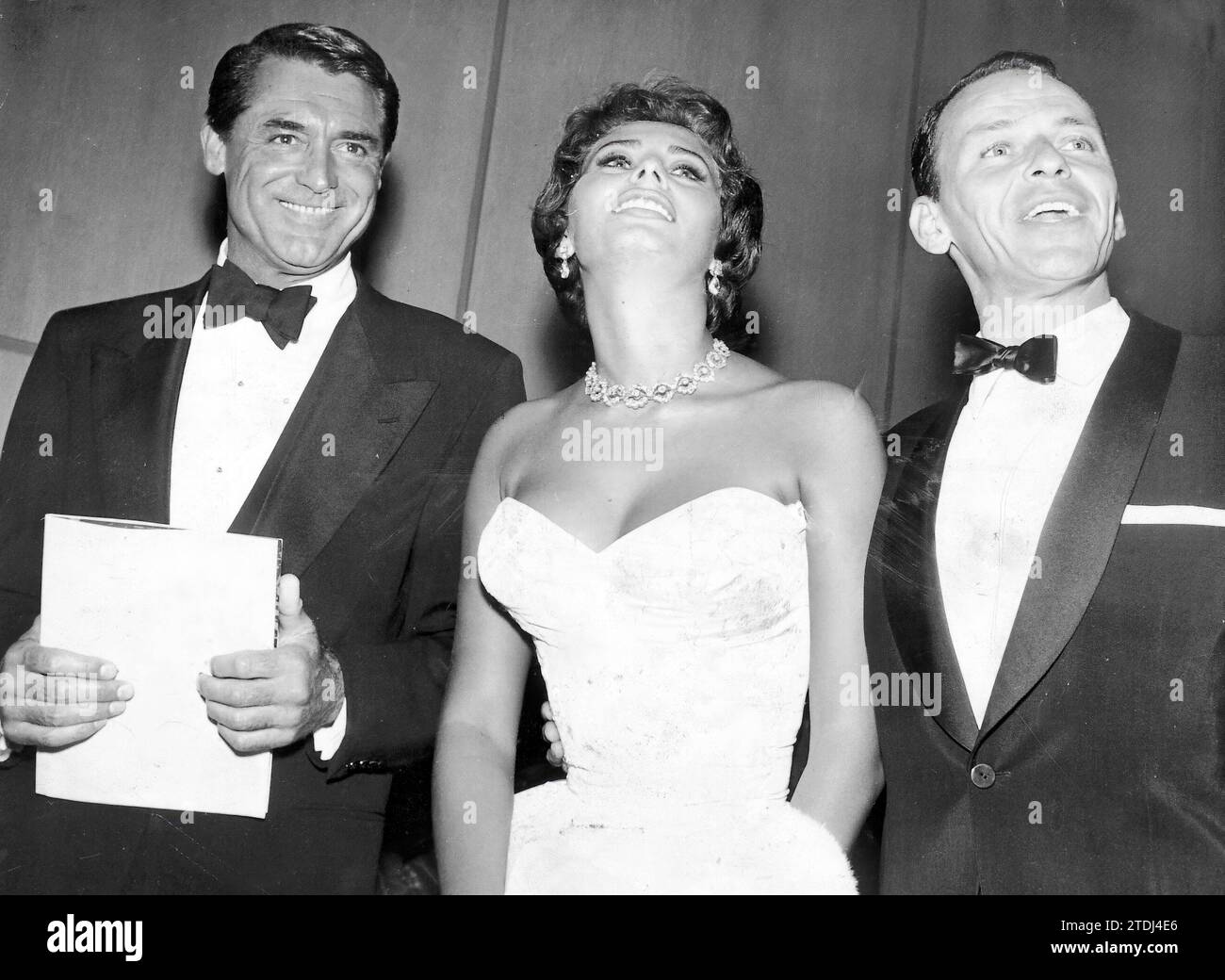 12/31/1950. Cary Grant, Sofia Loren and Frank Sinatra. Credit: Album / Archivo ABC Stock Photo