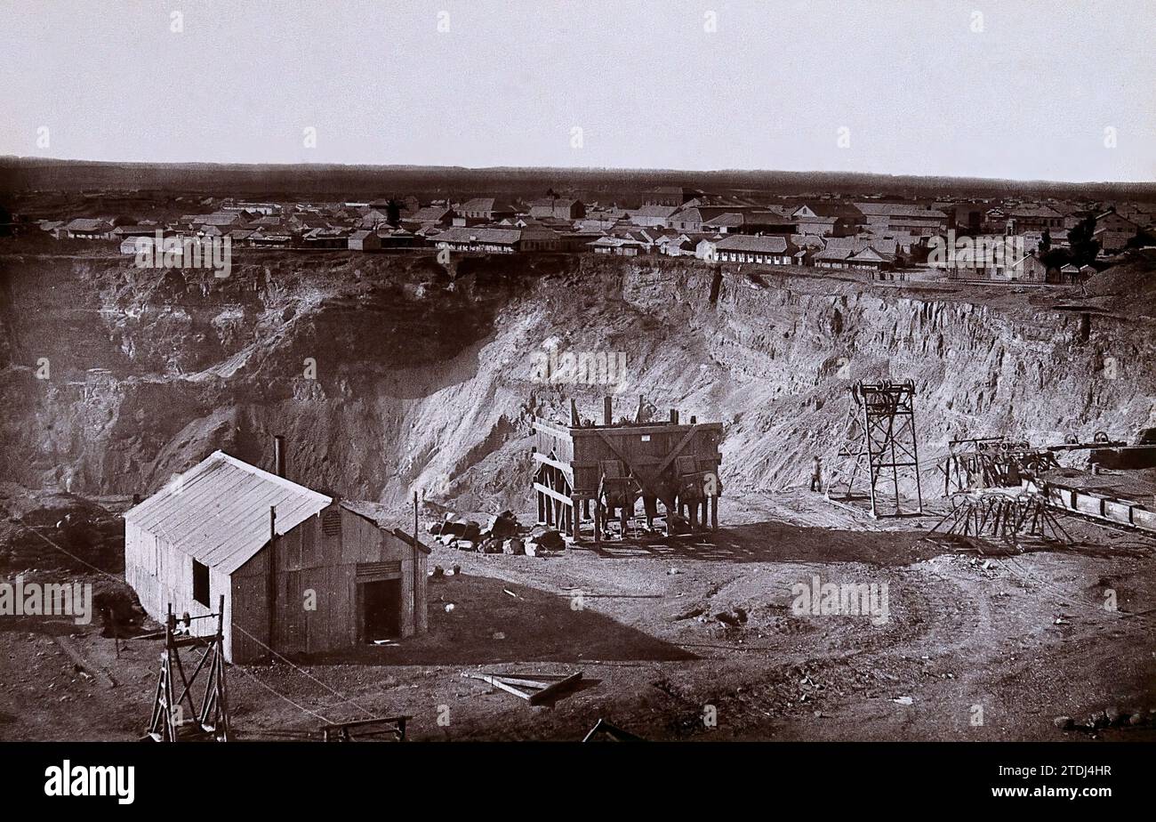 Diamond mining at Kimberley with the big hole being dug and the town in the distance, 1888, photo by Robert Harris, South Africa Stock Photo