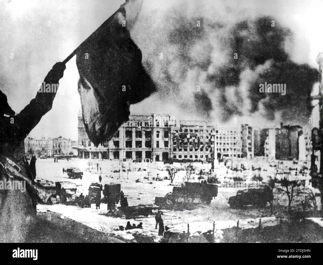 01/30/1943. Russian Troops Dominate Stalingrad. The Nazi flag stops flying. A Russian soldier shows it to his companions in front of the command post of the Sixth Army. Credit: Album / Archivo ABC Stock Photo