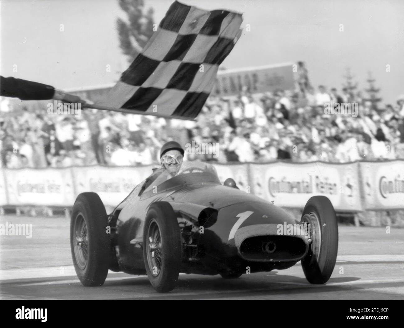 Germany, 08/04/1957. Juan Manuel Fangio entering the finish line of the 1957 German Grand Prix driving his Maserati. Credit: Album / Archivo ABC Stock Photo