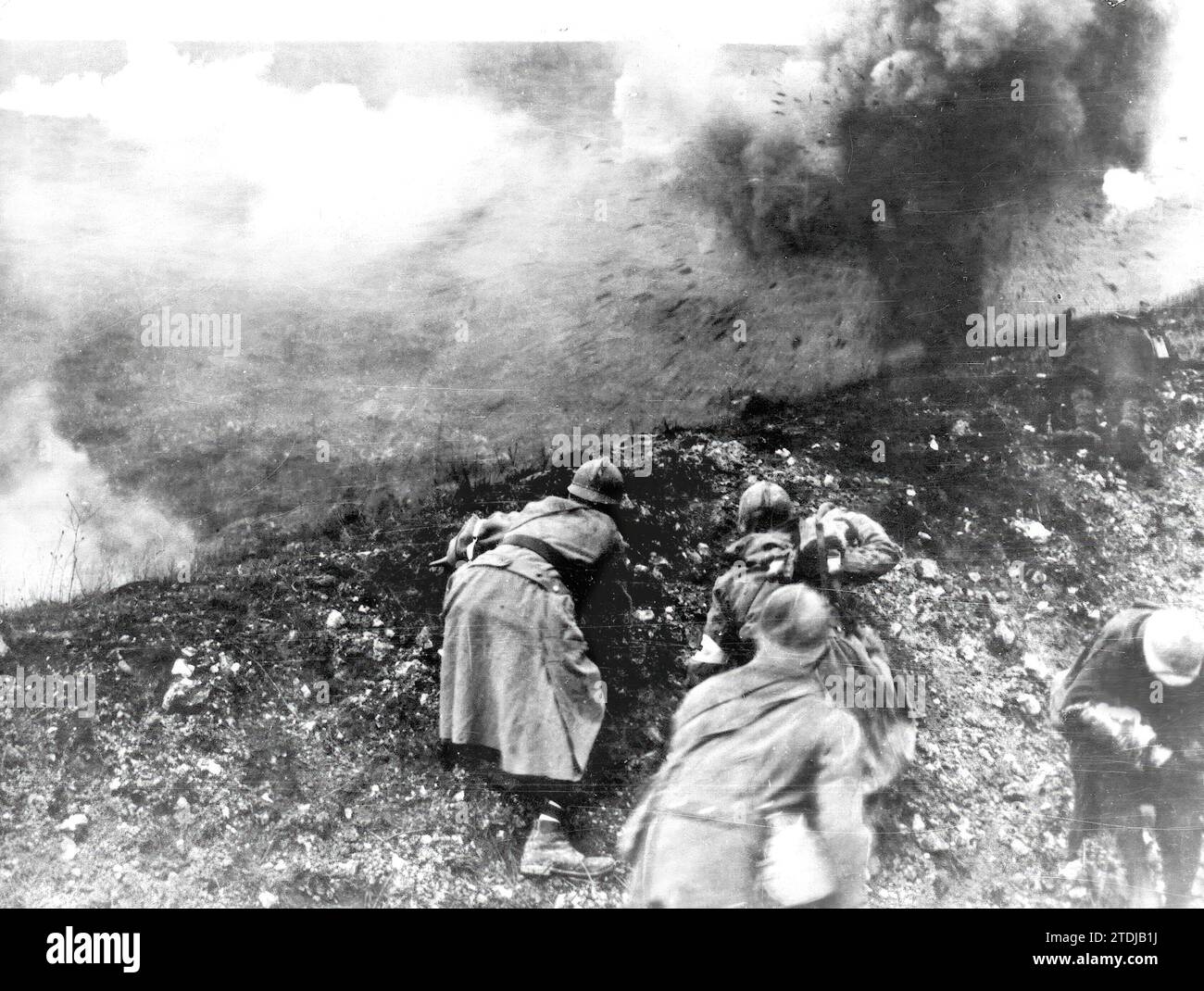 Verdun (France), 1916. A group of soldiers watch a projectile explode on the fields of Verdun (France), where one of the bloodiest battles was fought for almost a year. Credit: Album / Archivo ABC Stock Photo
