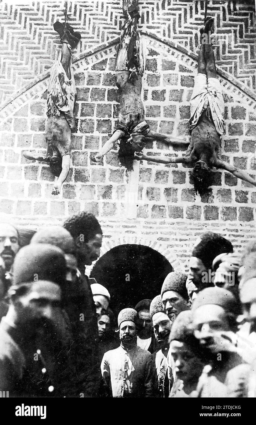 12/31/1899. The Executions in Persia. Three Condemned to Death Hanging by Their Feet on the Walls of the Courthouse. Credit: Album / Archivo ABC Stock Photo