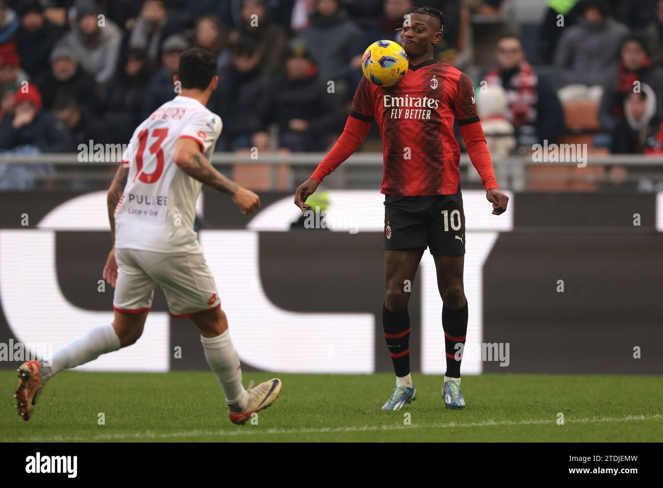 Milan, Italy. 17th Dec, 2023. Rafael Leao of AC Milan controls the ball as Pedro Pereira of AC Monza closes in during the Serie A match at Giuseppe Meazza, Milan. Picture credit should read: Jonathan Moscrop/Sportimage Credit: Sportimage Ltd/Alamy Live News Stock Photo