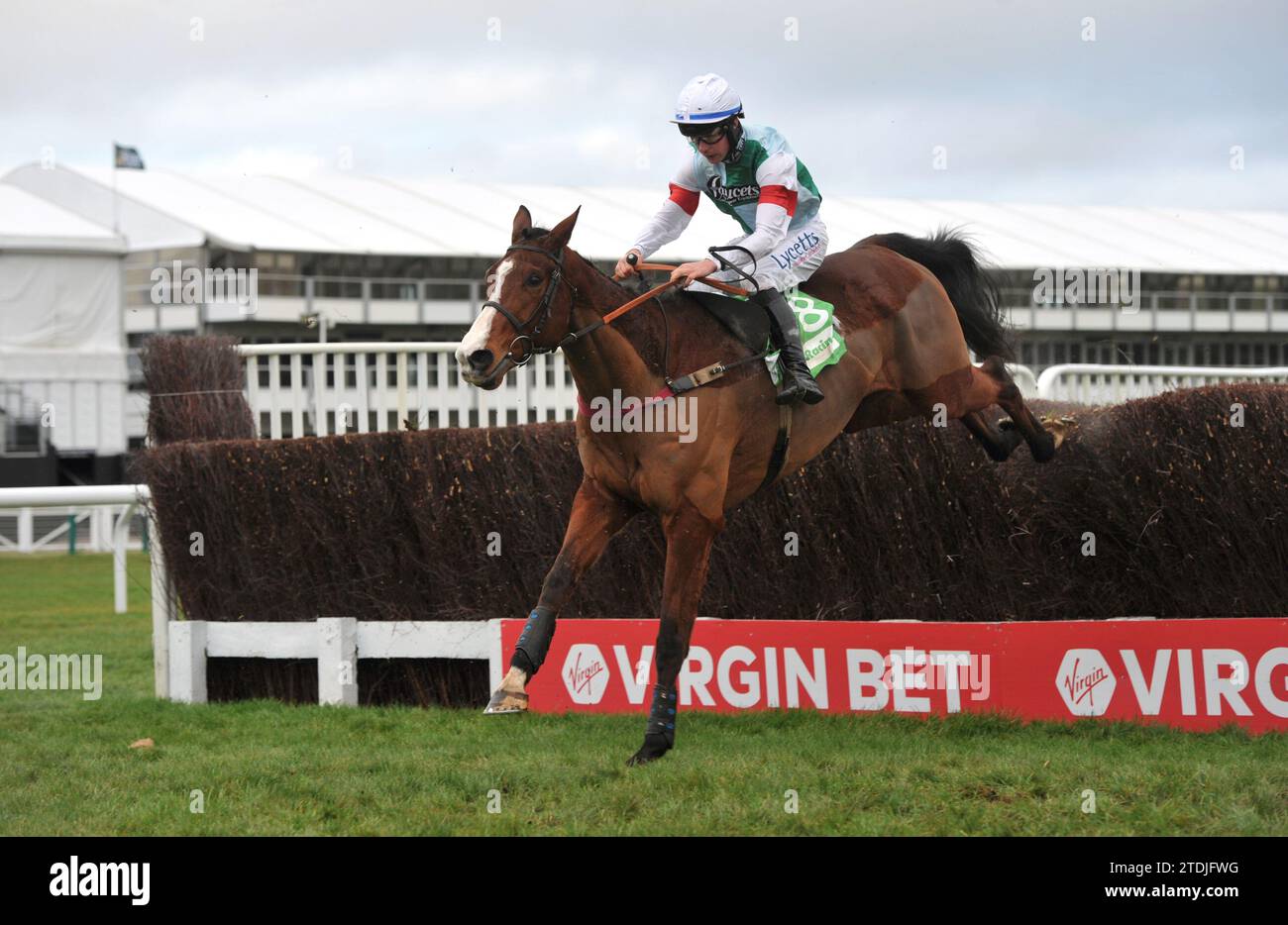 Racing at Cheltenham Day 2 of the Christmas Meet   Race 5 The Favourite from The Sun Now Daily Handicap Chase.    Easy As That ridden by Charlie Deuts Stock Photo