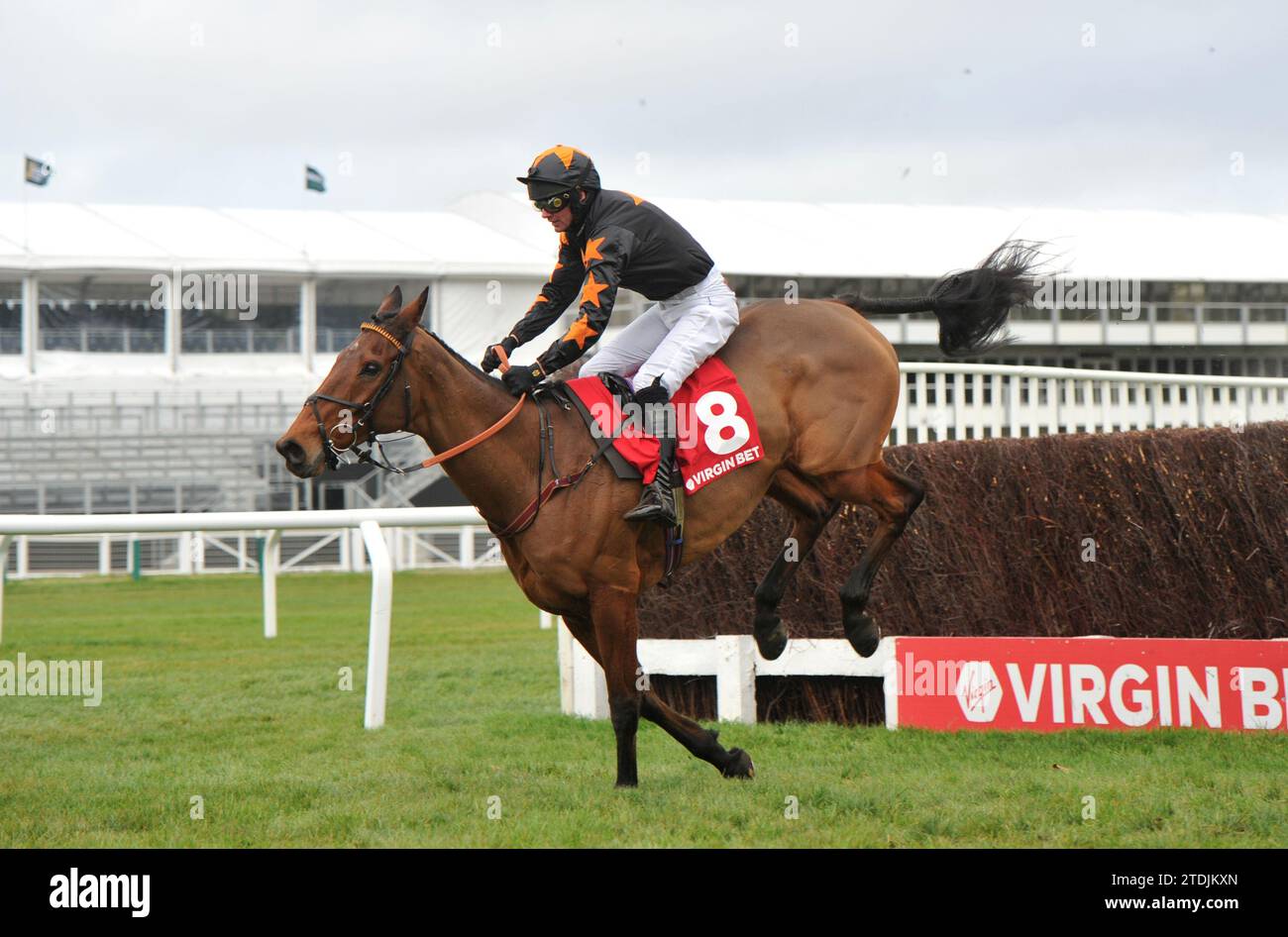 Racing at Cheltenham Day 2 of the Christmas Meet   Race 4 The Virgin Bet December Gold Cup Handicap Chase    Do Your Job ridden by Derek Fox jumps the Stock Photo