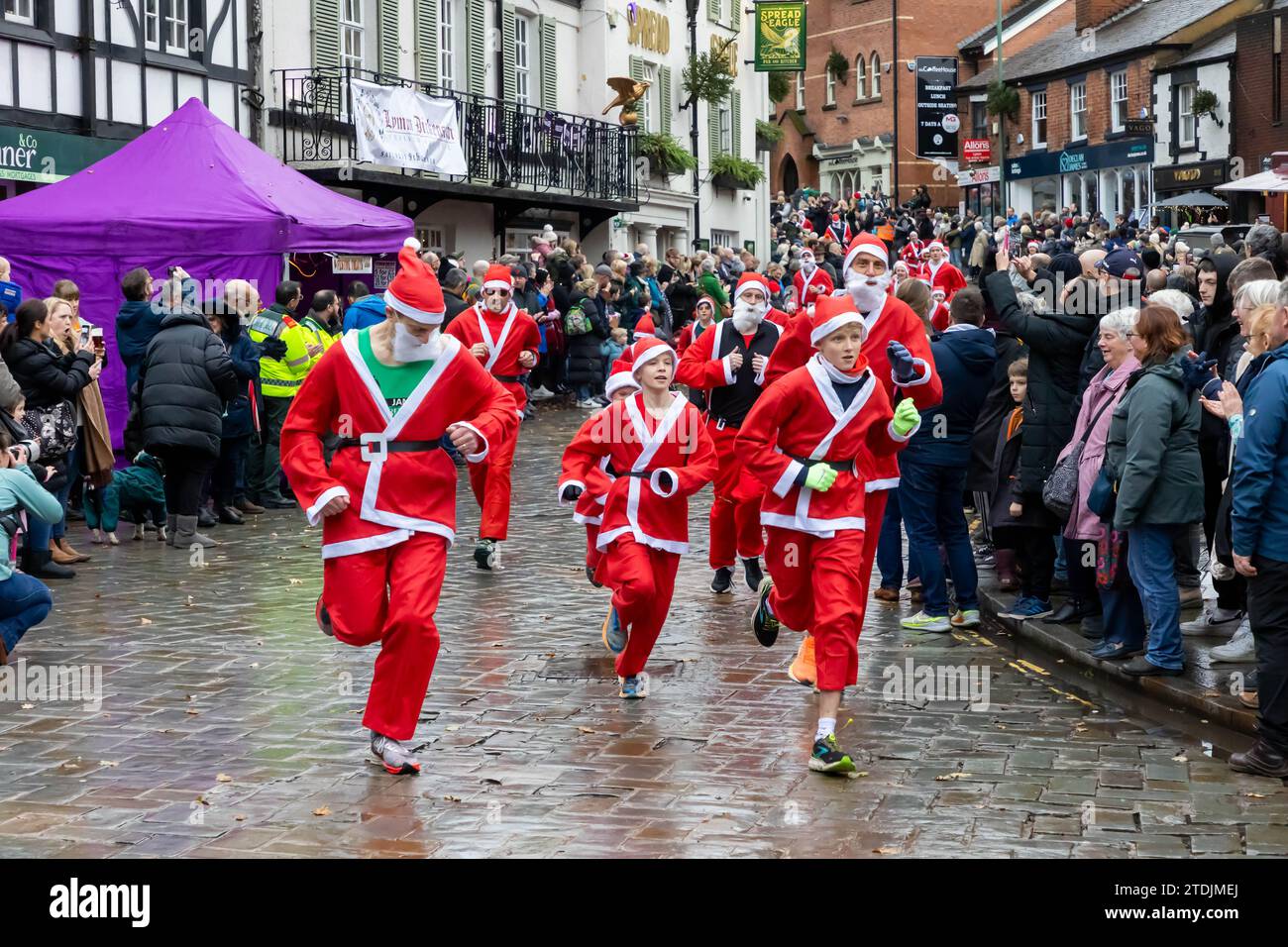 The 2023 Santa Dash ran through the village of Lymm, Cheshire, at the Dickensian Day Festival Stock Photo