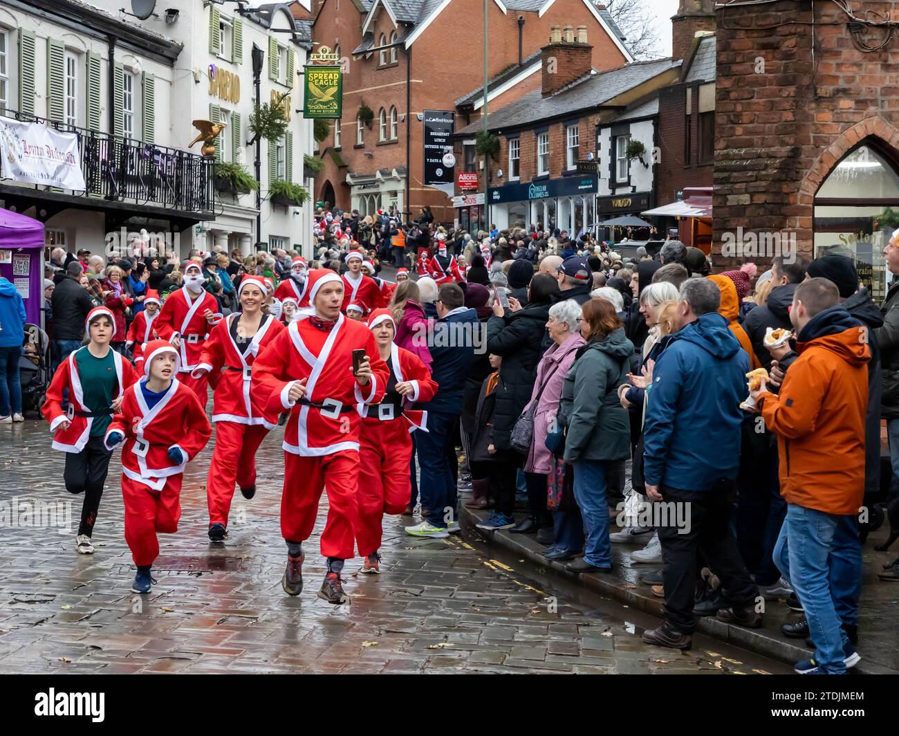 The 2023 Santa Dash ran through the village of Lymm, Cheshire, at the Dickensian Day Festival Stock Photo