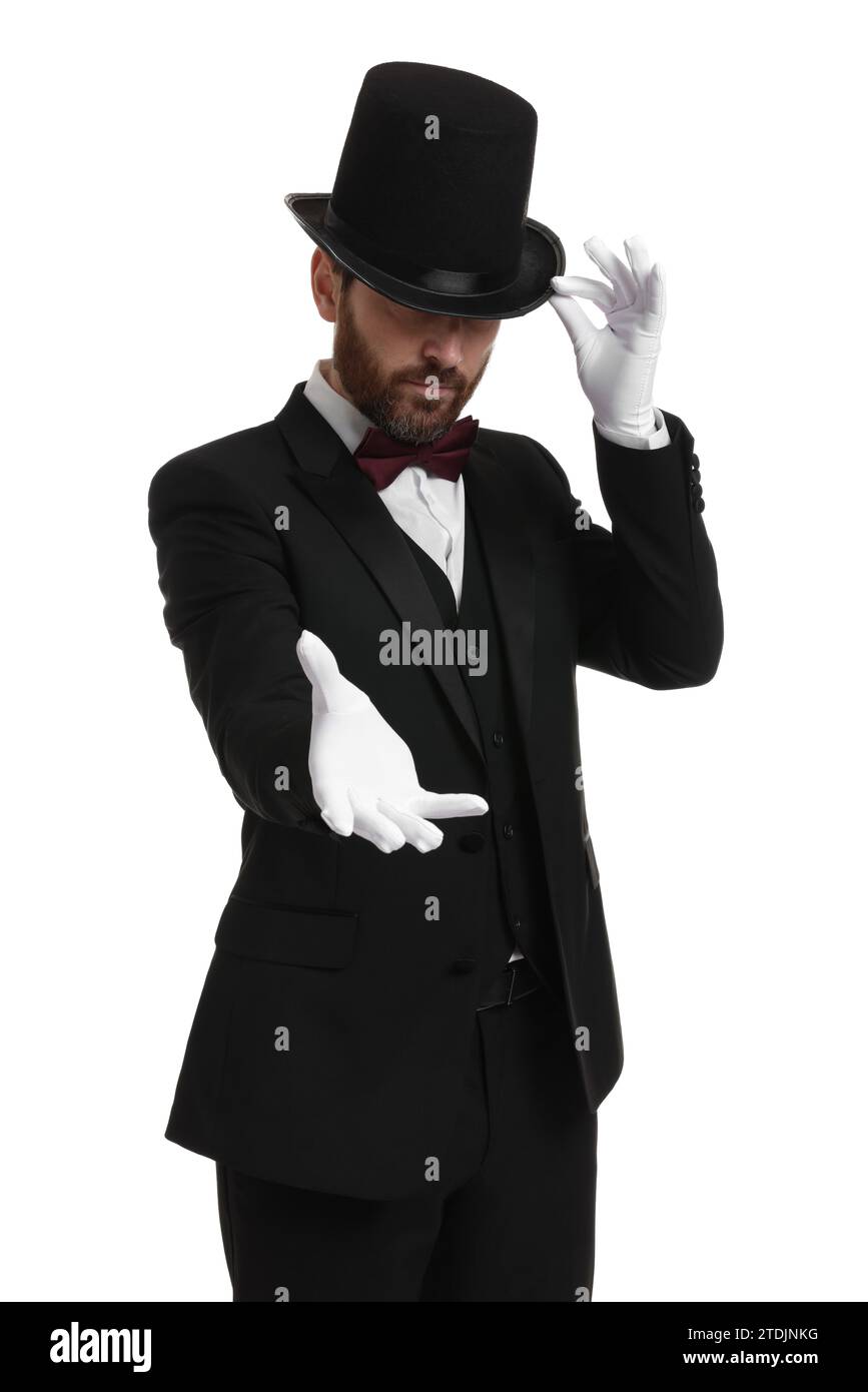 Magician in top hat on white background Stock Photo - Alamy