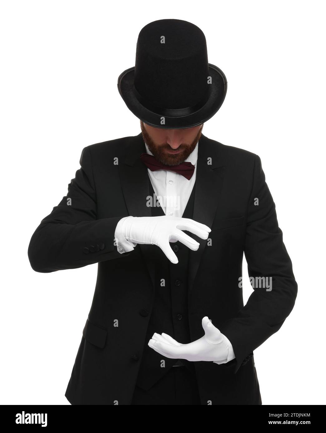 Magician in top hat holding something on white background Stock Photo ...