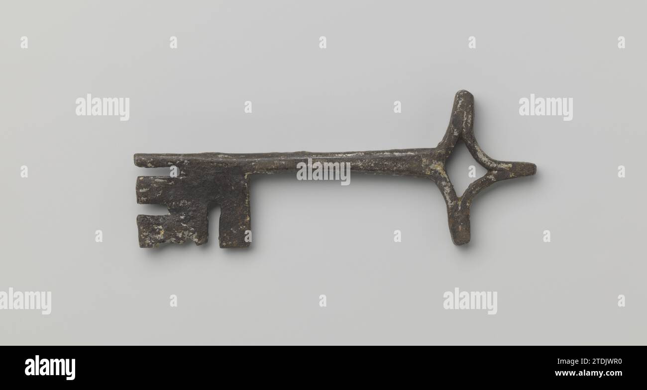 Key of iron, 1200 - 1400 Forged iron key with cross -shaped ring, closed angular pipe and wide flat beard.  iron (metal) Forged iron key with cross -shaped ring, closed angular pipe and wide flat beard.  iron (metal) Stock Photo