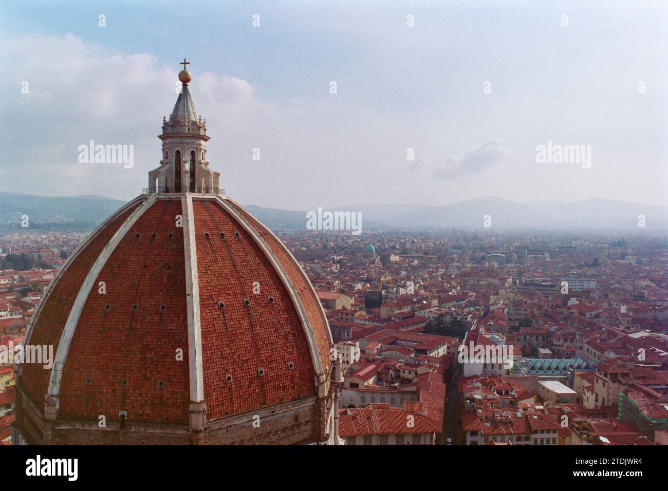 Grainy archival film photograph of the Cathedral Santa Maria del Fiore dome with historic Florence Italy in background.  Shot in January 1994. Stock Photo