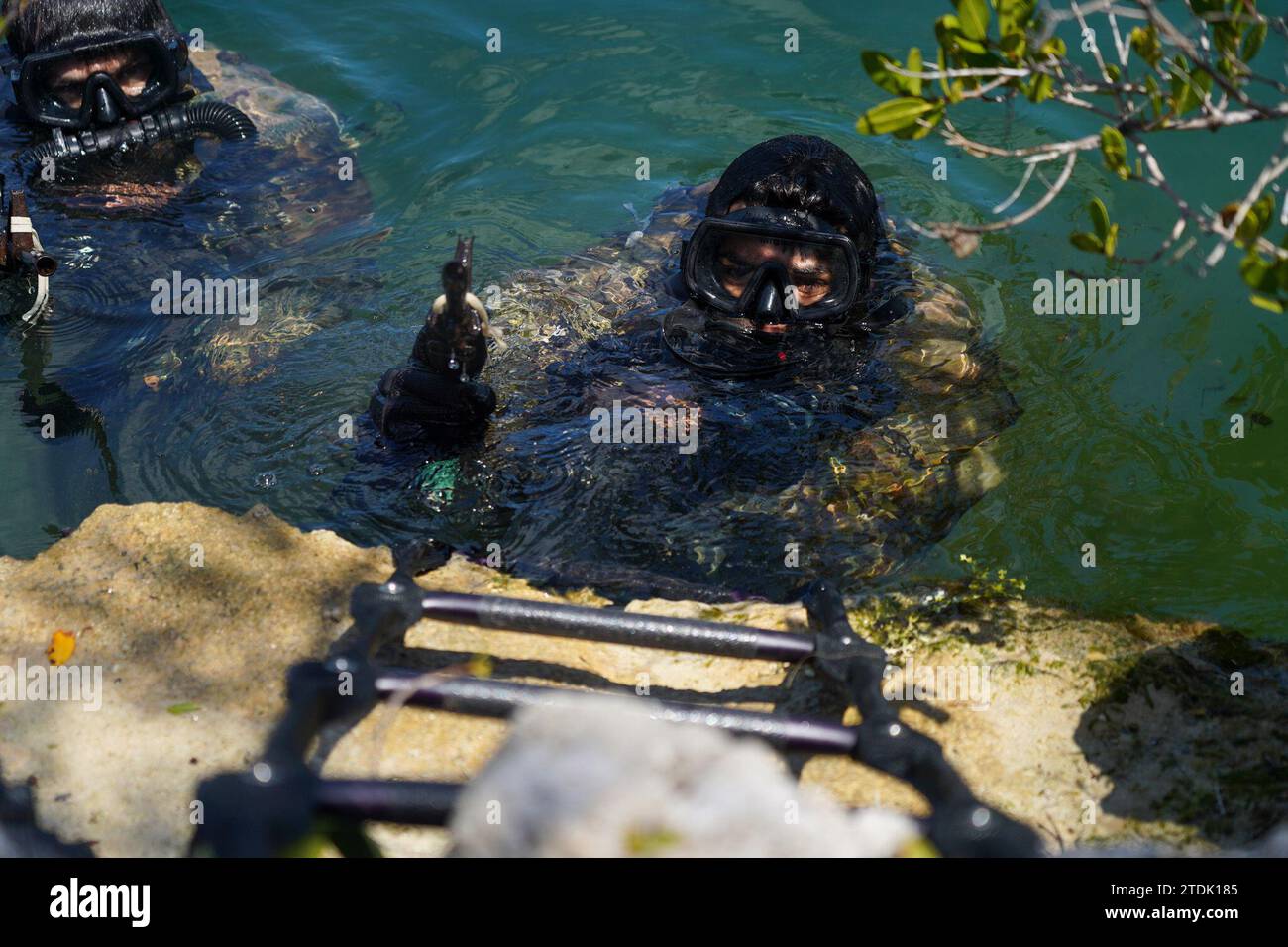 U.S. Soldiers Green Berets climbs ladder at the Special Forces