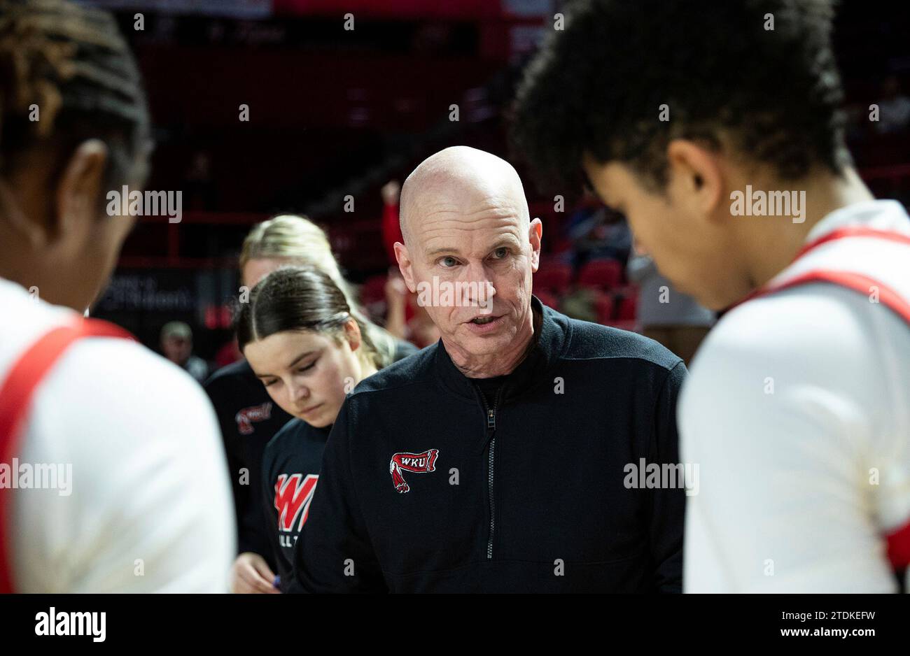Western Kentucky head coach Greg Collins, center, gathers the team in a ...