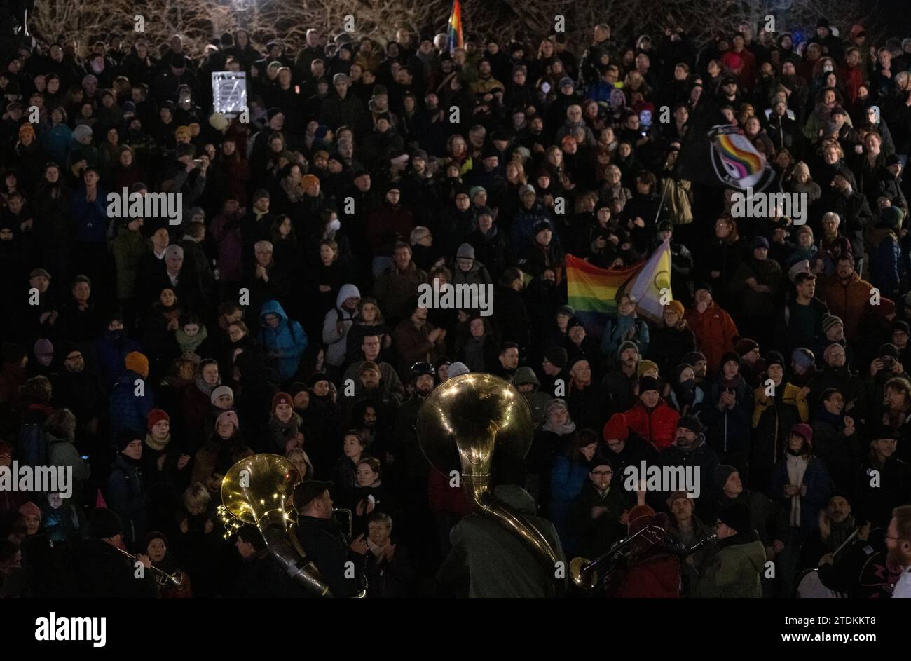 Dresden, Germany. 18th Dec, 2023. Participants in a counter-demonstration organized by the "Herz statt Hetze" initiative take part in the protest against an announced demonstration by the right-wing extremist movement Pegida on Schlossplatz. Credit: Robert Michael/dpa/Alamy Live News Stock Photo
