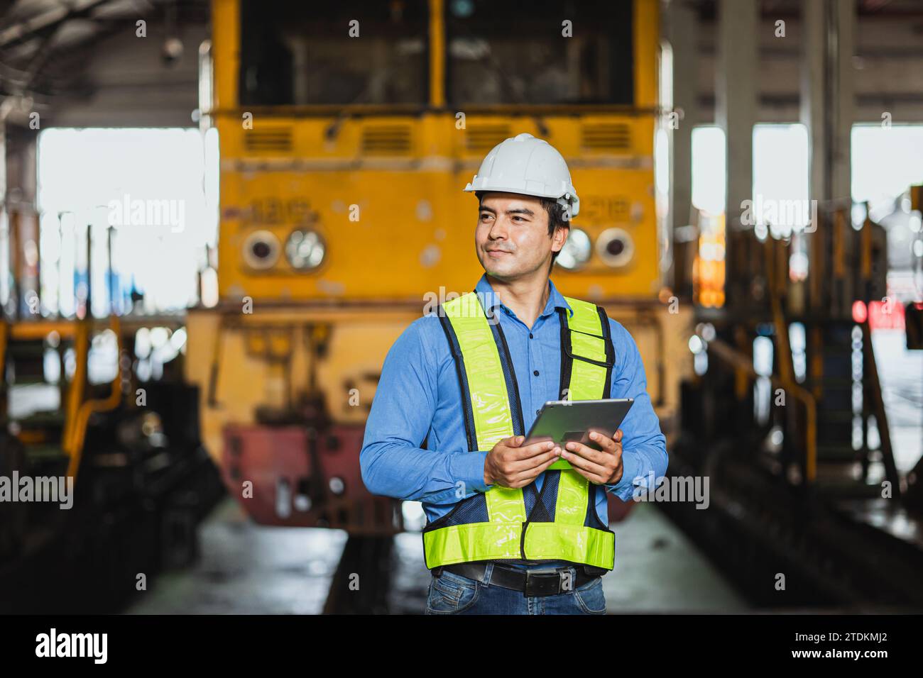 Train locomotive engineer male supervisor happy working service in train depot, transportation industry worker. Stock Photo