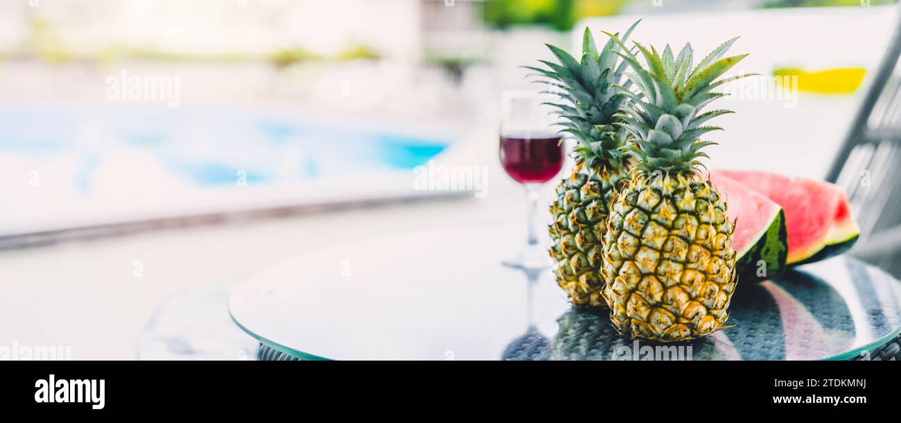 Blur shallow depth of field of tropical fruits with welcome drinks at pool wide banner for hotel tourist travel holiday summer vacation advertising ba Stock Photo