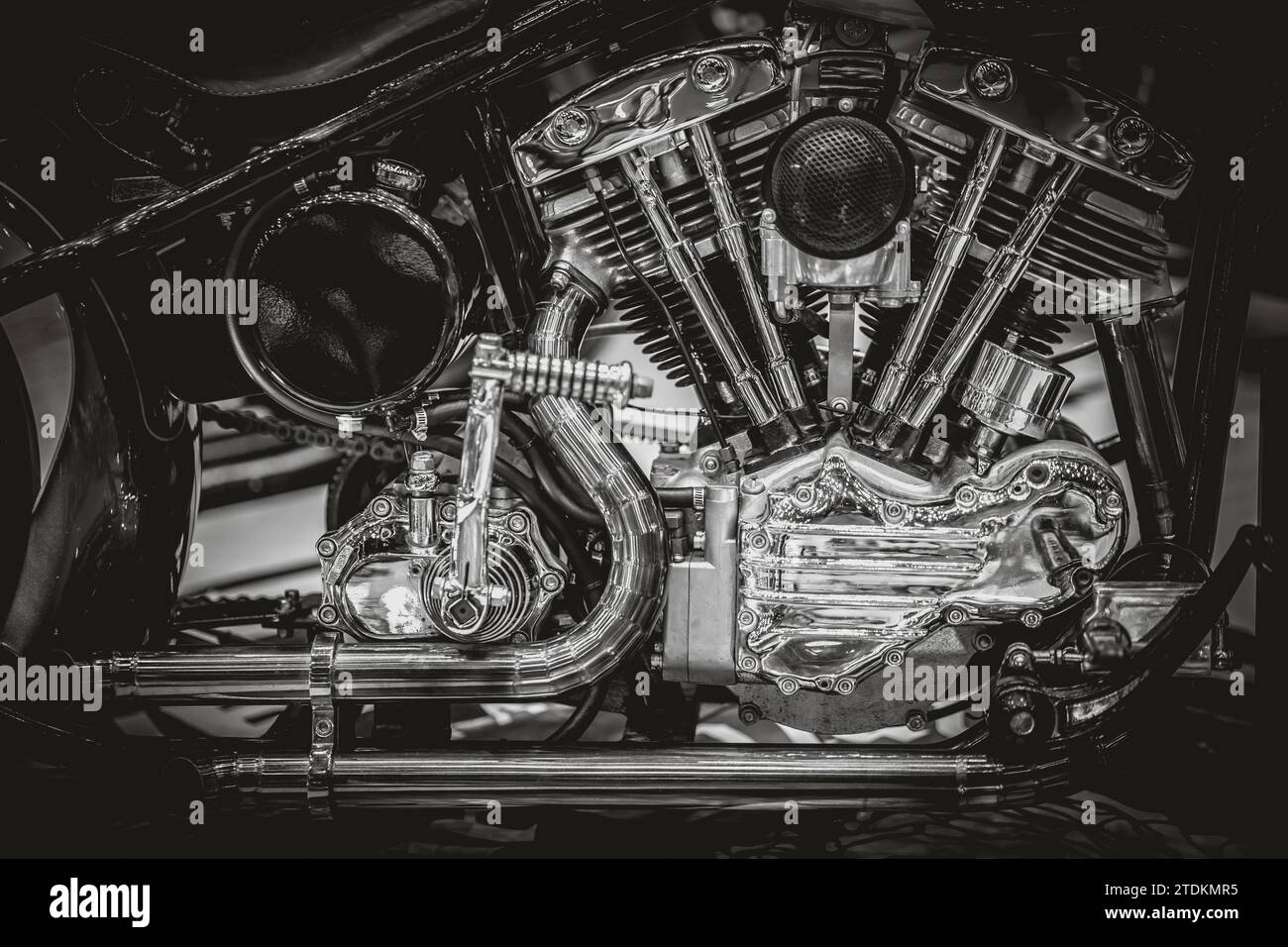 shiny chrome motorcycle engine engine exhaust pipes art photography in black and white vintage tone Stock Photo