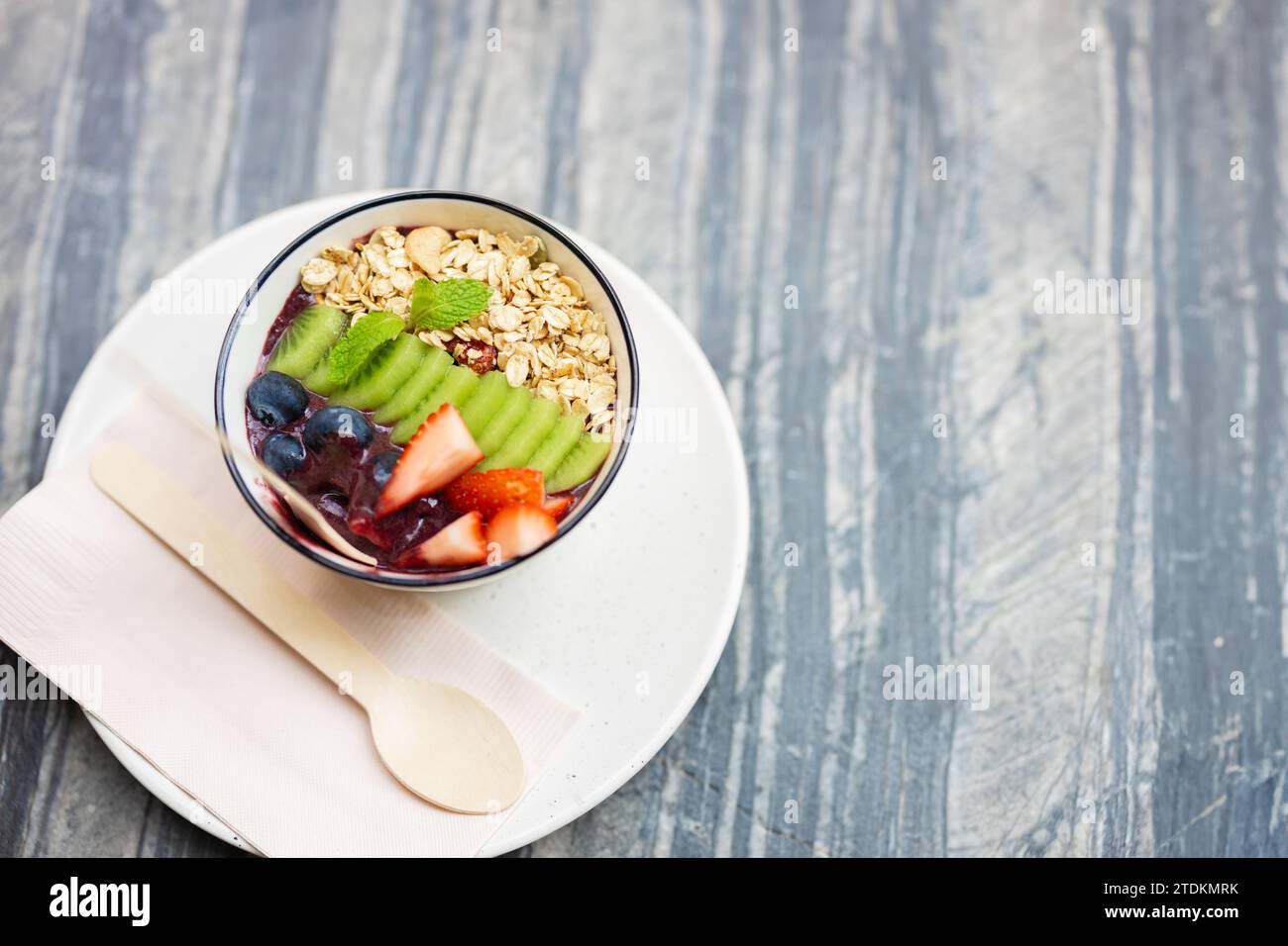 Healthy food rich vitamin and fiber morning meal bowl. colorful mix berry fruity with cereal whole grain food vertical shot. Stock Photo