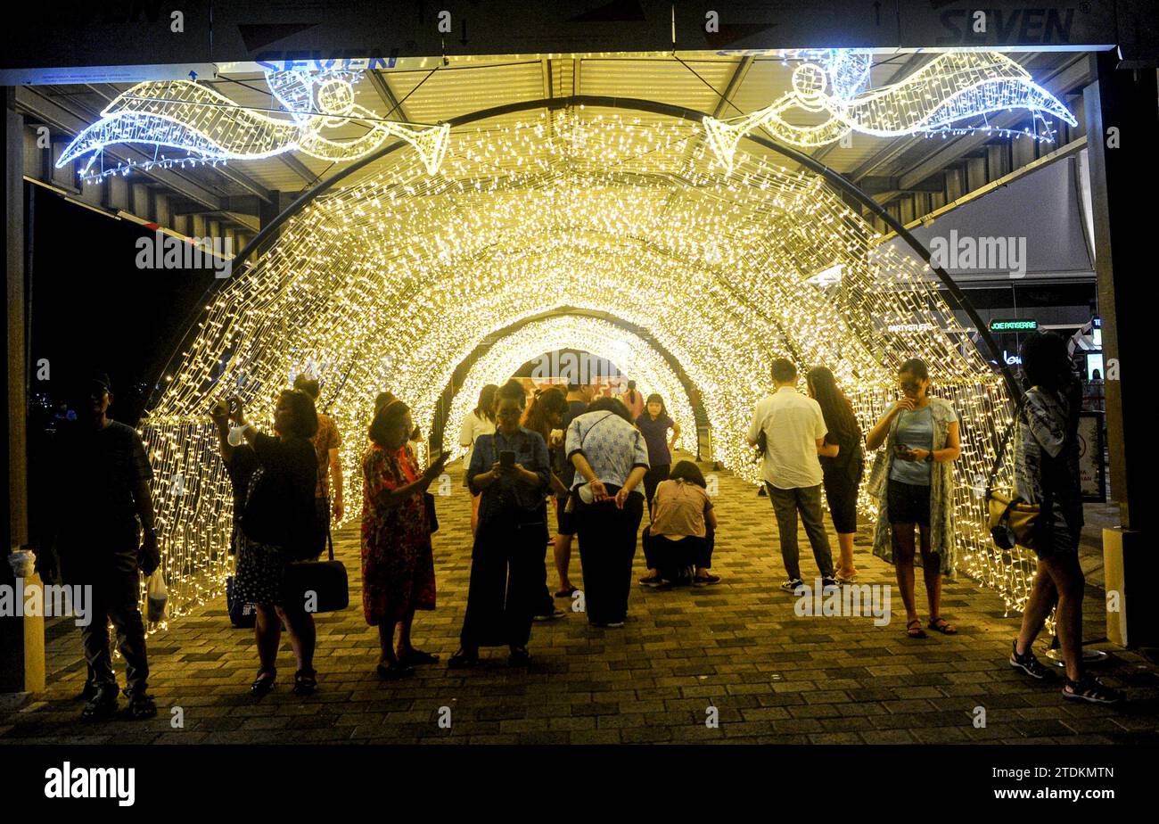 Surabaya, Indonesia. 18th Dec, 2023. People visit Christmas Wonderland, a light show event, at