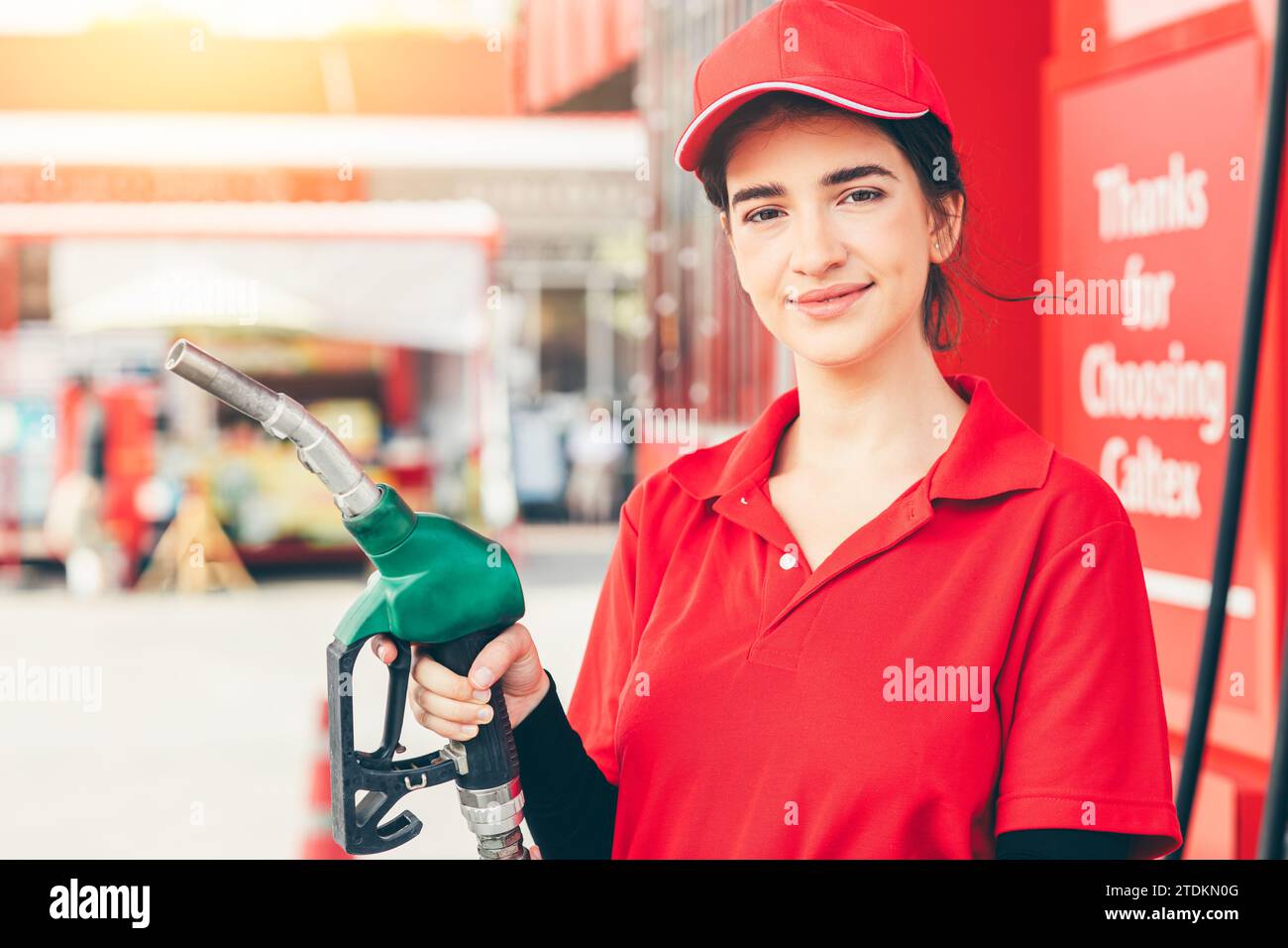 Gas station service staff worker women happy smiling with fuel nozzle