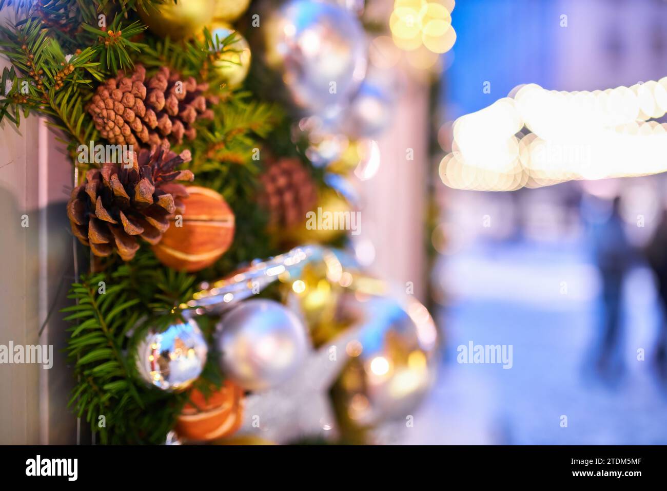 Christmas tree with red balloons on city street at night Stock Photo ...
