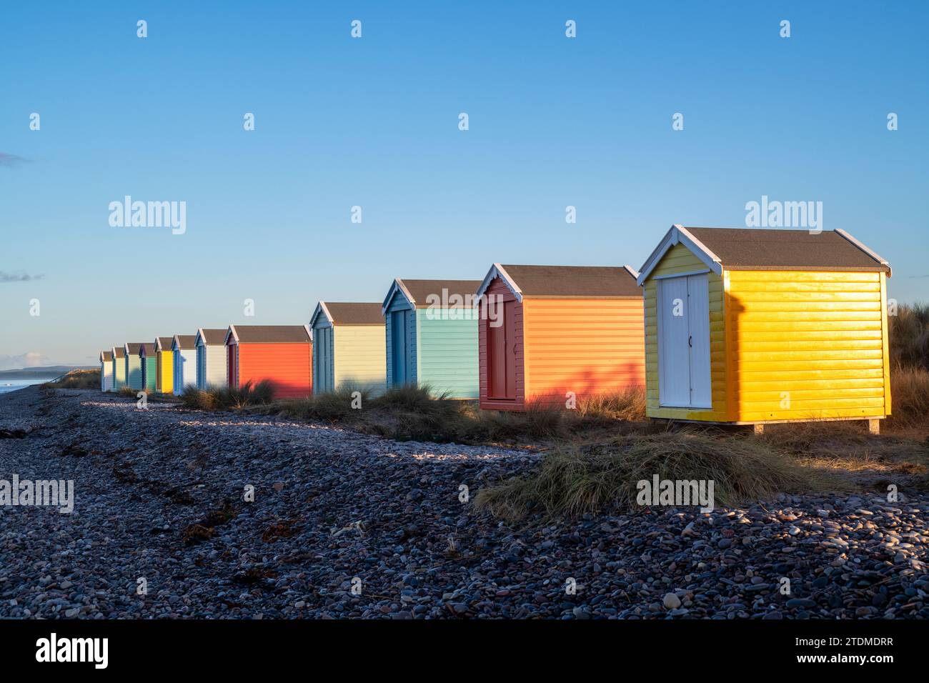 Painted beach huts on Findhorn beach. Morayshire, Scotland Stock Photo