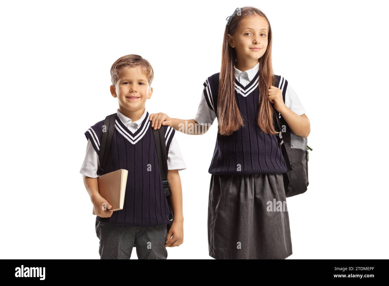 Schoolchildren in uniforms isolated on white background Stock Photo