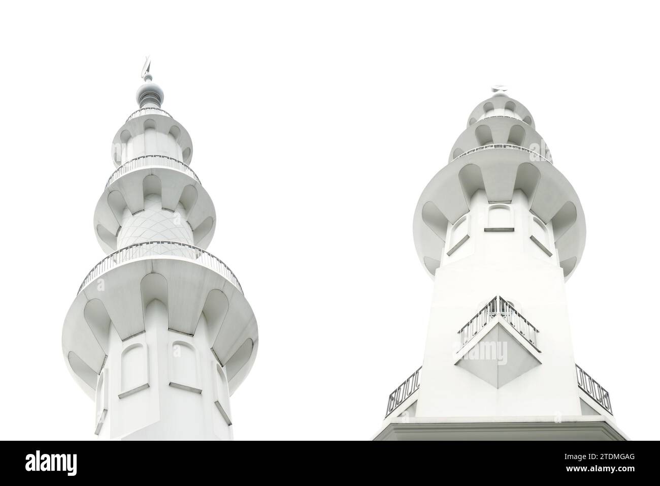 The minaret of the mosque is isolated over a white background Stock Photo