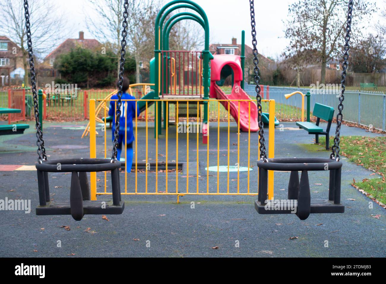 Swings designed for young children and toddlers in the playground at