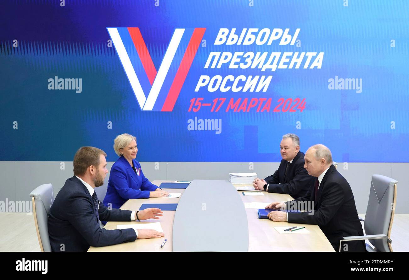 Moscow, Russia. 18 December, 2023. Russian President Vladimir Putin, right, submits his documents to be registered as a candidate in the upcoming 2024 Russian presidential election at the Central Election Commission, December 18, 2023 in Moscow, Russia. Credit: Russian Presidency/Kremlin Pool/Alamy Live News Stock Photo