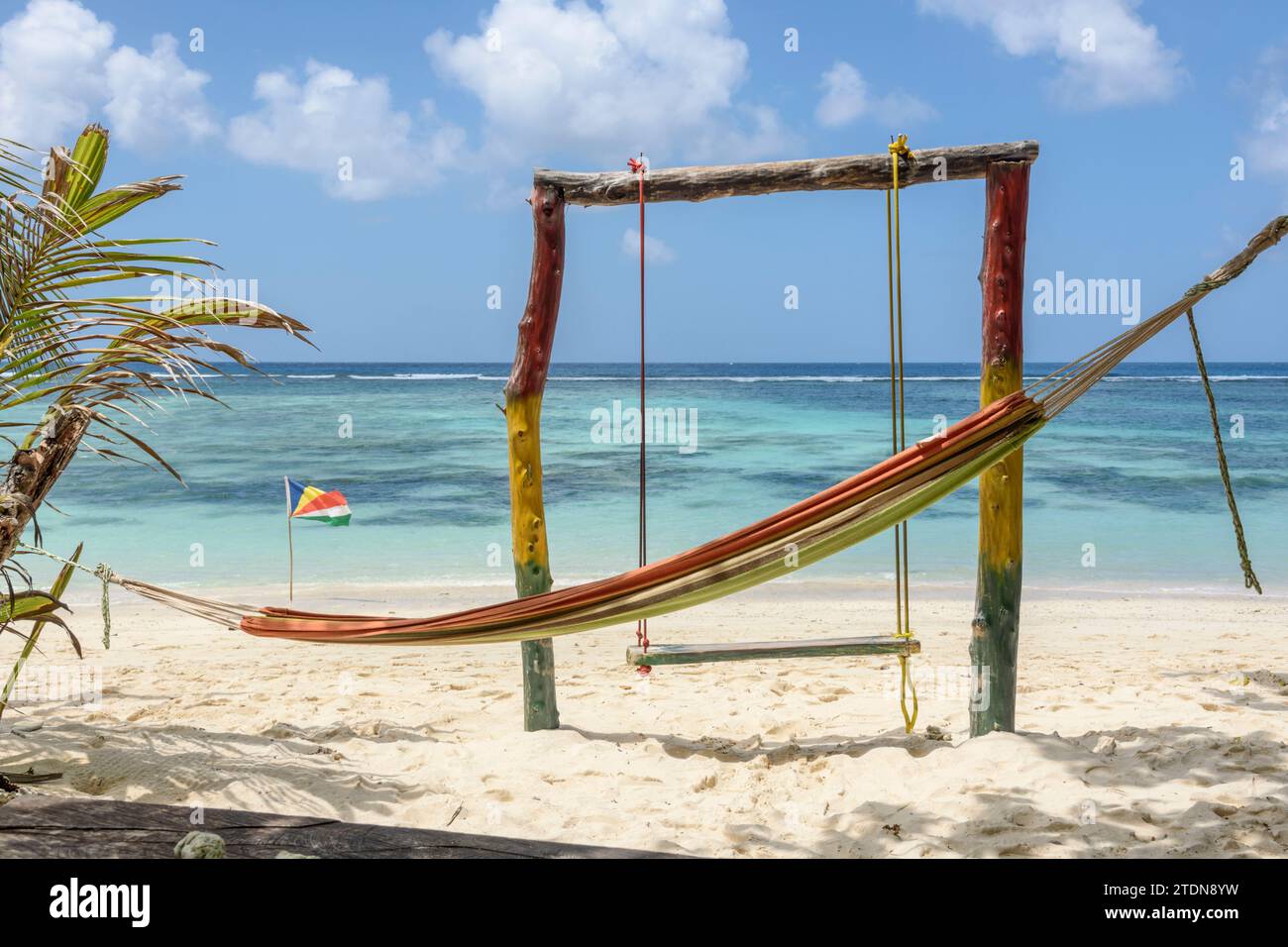 Hammock and swing at a beach cafe shack on Anse Source d'Argent, La Digue Island, Seychelles. Indian Ocean Stock Photo