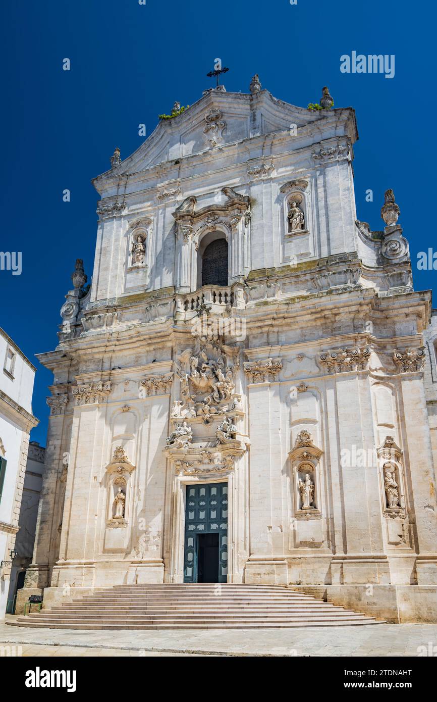 Martina Franca, Taranto, Puglia, Italy. Village with baroque architecture. The Collegiate Church of San Martino in the beautiful Piazza Plebiscito. Bl Stock Photo