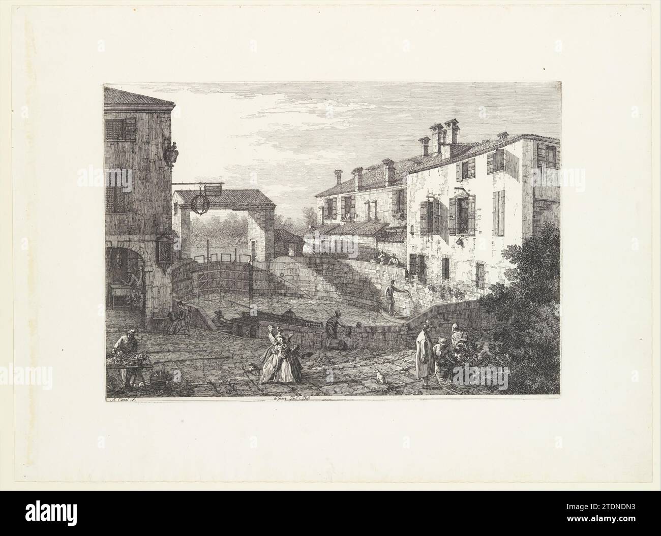 The Locks at Dolo, an oval-shaped basin with boats at center, buildings on either side, a fruit vendor and groups of figures in the foreground, from 'Views' (Vedute altre prese da i luoghi altre ideate da Antonio Canal) 1918 by Joseph Smith Stock Photo
