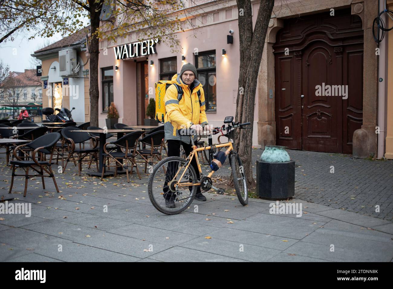 Belgrade, Serbia, Dec 15, 2023: A dispatch rider prepares to deliver an ...