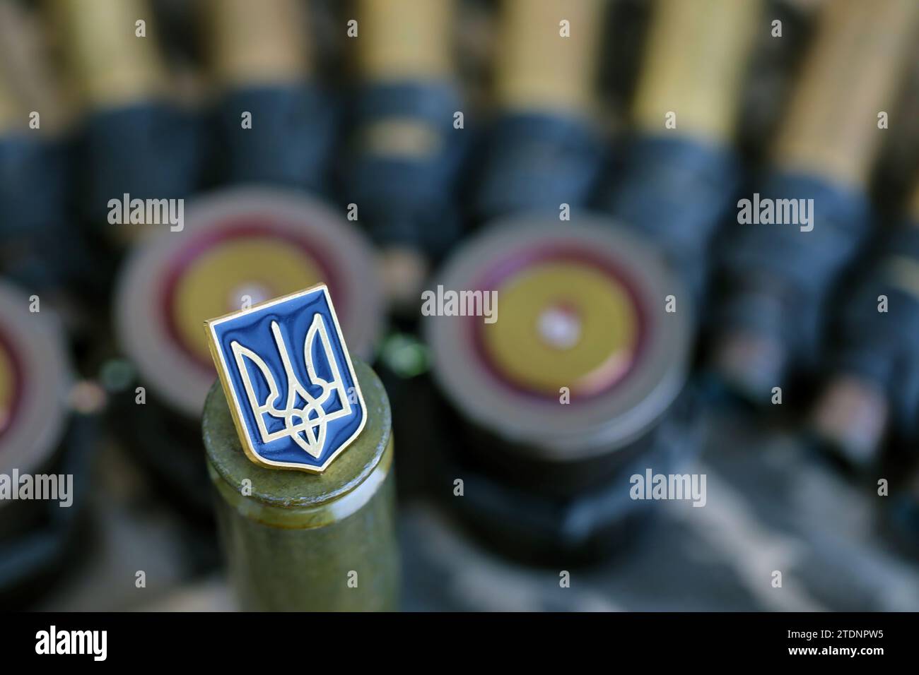 Ukrainian symbol on machine gun belt lies on ukrainian pixeled military ...