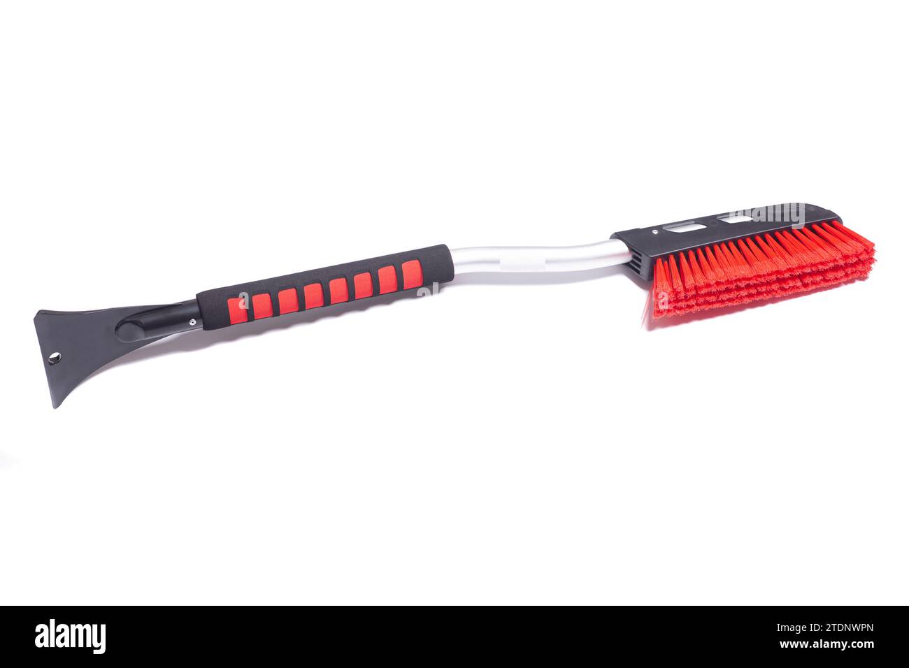 Car brush with a scraper for cleaning the car in winter about snow and