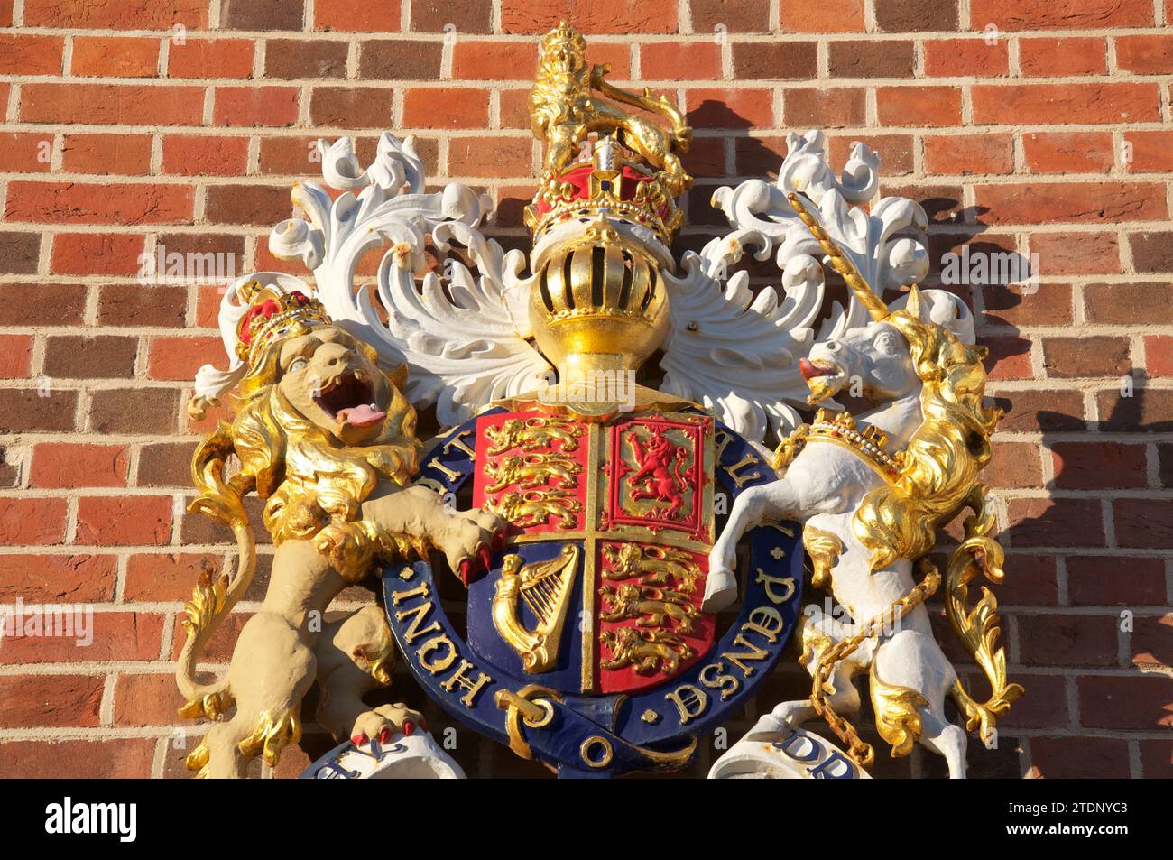 The Royal Coat of Arms of the Monarch of the United Kingdom, above the