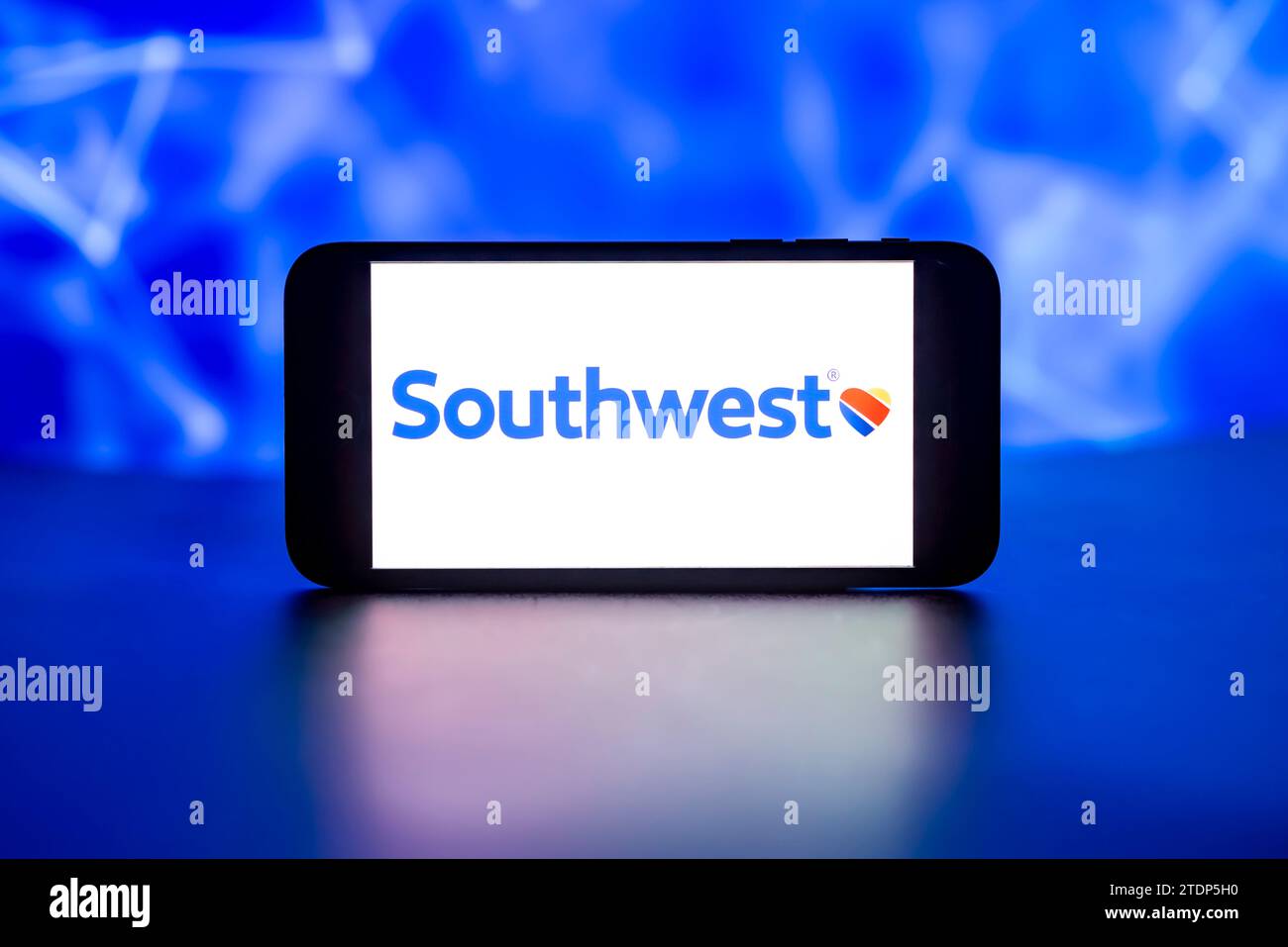 In this photo illustration, the Southwest Airlines logo is seen displayed on a mobile phone screen. Stock Photo