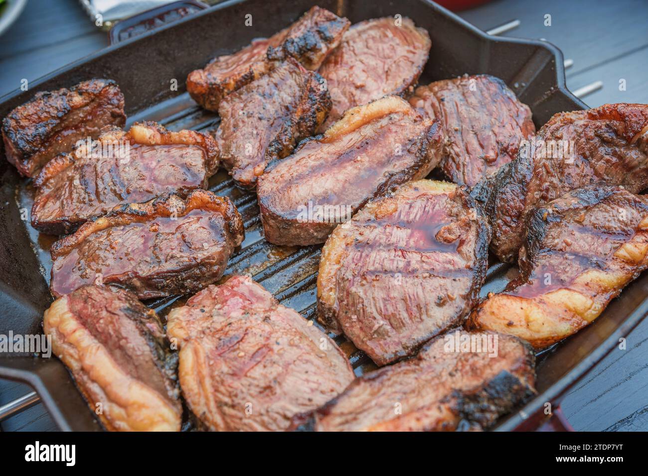 Grilled sirloin or rump fillets seen up close in the frying pan. Stock Photo