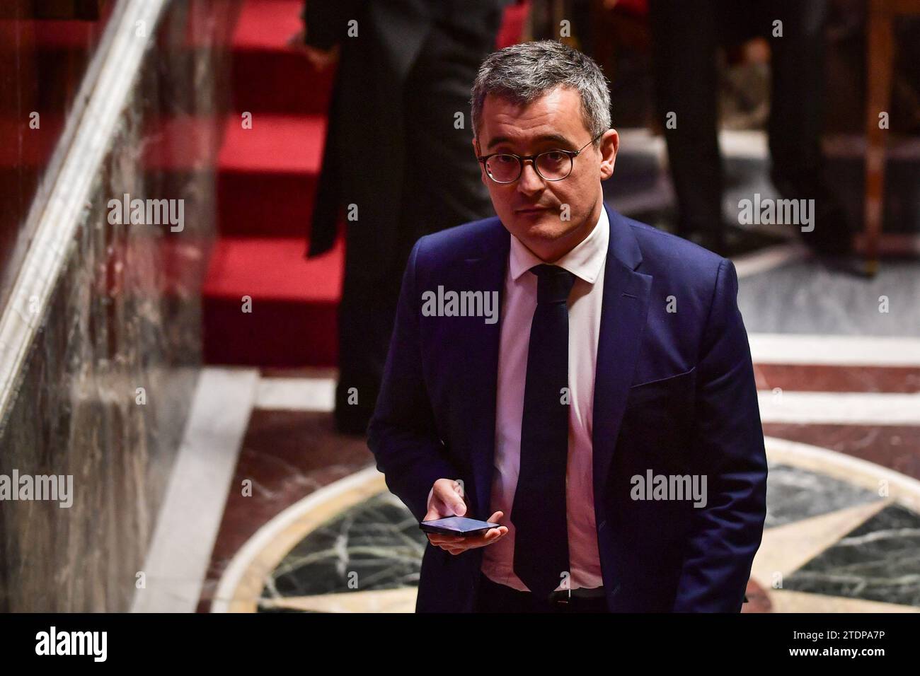French Interior Minister Gerald Darmanin walks during a debate on a