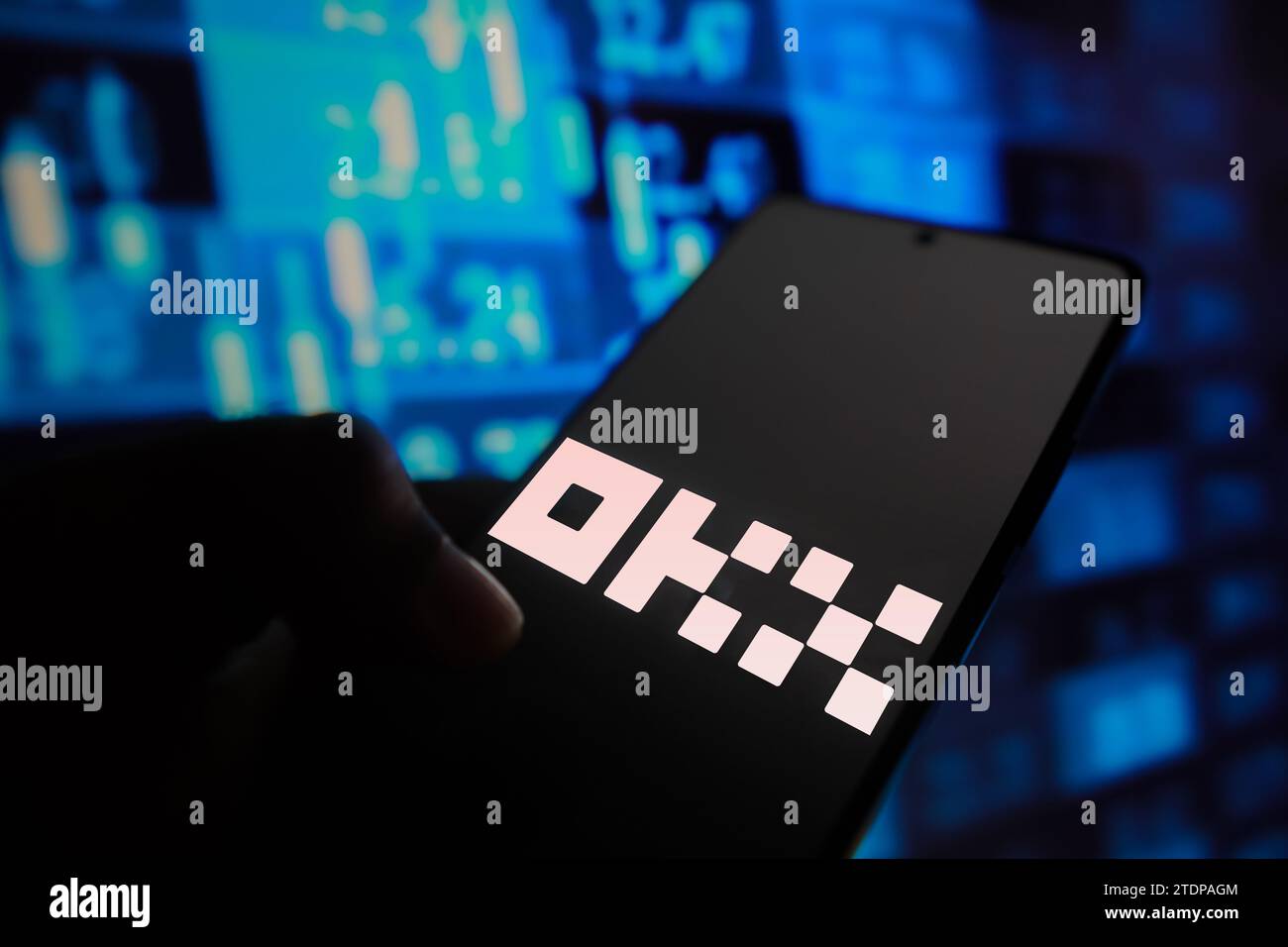 Brazil. 18th Dec, 2023. In this photo illustration, the OKX logo is displayed on a smartphone screen with stock market percentages in the background. (Credit Image: © Rafael Henrique/SOPA Images via ZUMA Press Wire) EDITORIAL USAGE ONLY! Not for Commercial USAGE! Stock Photo