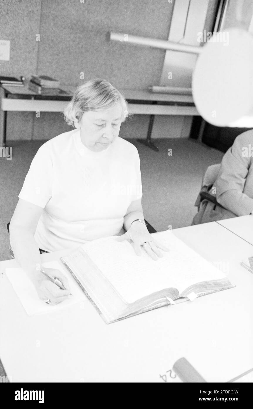 Mrs. Hoogwater Genealogist in State Archives, State Archives, 06-09-1983, Whizgle News from the Past, Tailored for the Future. Explore historical narratives, Dutch The Netherlands agency image with a modern perspective, bridging the gap between yesterday's events and tomorrow's insights. A timeless journey shaping the stories that shape our future Stock Photo