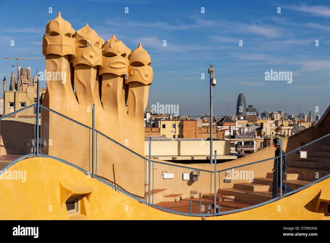 The ‘Guardians’ on the rooftop of Casa Milà with Sagrada Familia in the ...