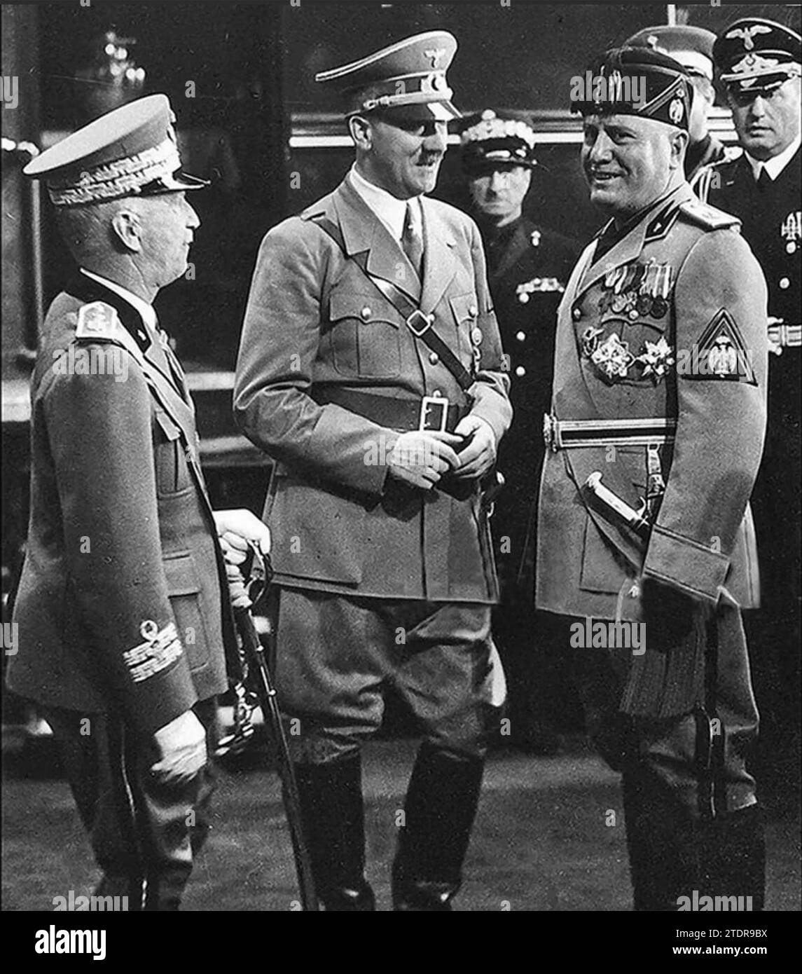 HITLER in Italy 1938 with Benito Mussolini at right and King Victor Emmanuel III. Stock Photo