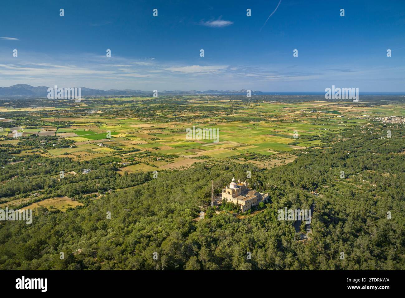 Aerial view of the Puig de Bonany sanctuary and mountain and fields and rural surroundings on a spring afternoon (Mallorca, Balearic Islands, Spain) Stock Photo