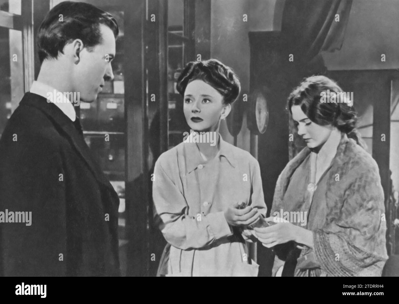 Michael Denison, Dulcie Gray, and Josephine Stuart star in 'My Brother Jonathan' (1948), a touching British drama. Denison portrays Jonathan Dakers, a doctor torn between his career and his complicated love life, including his deep affection for Gray's character, Edie Martyn, and his interactions with Stuart's supportive role. Their performances skillfully reflect the emotional and societal intricacies of early 20th-century England. Stock Photo